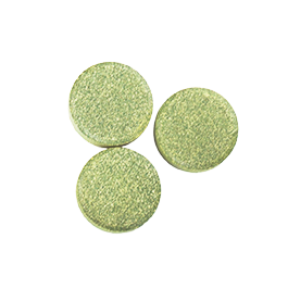 Arrangement of 3 round and speckled green tablets.